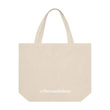 Load image into Gallery viewer, Back of canvas bag with @thesaudashop in white letters
