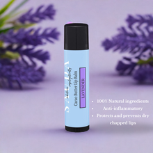 Load image into Gallery viewer, Lip balm with lavender flowers in the background and wording nexrt to the tube
